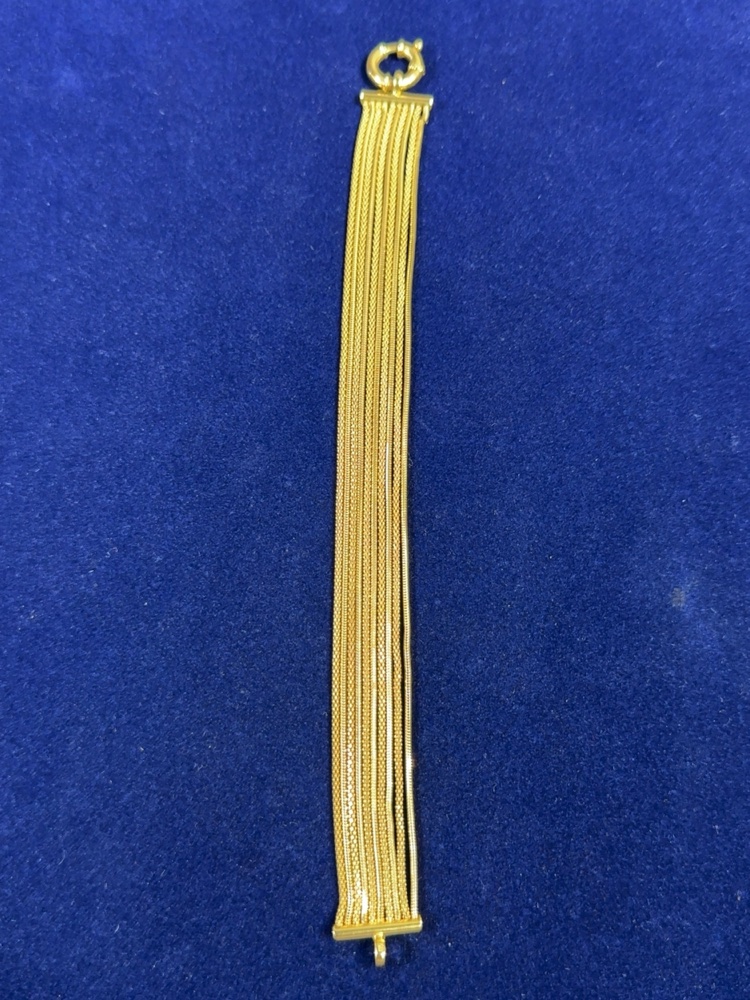 yellow gold bracelet of nine chain strands with a decorative clasp